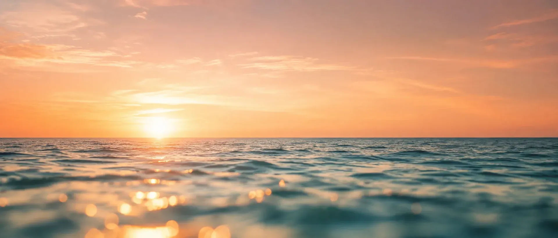 A calm ocean at sunset