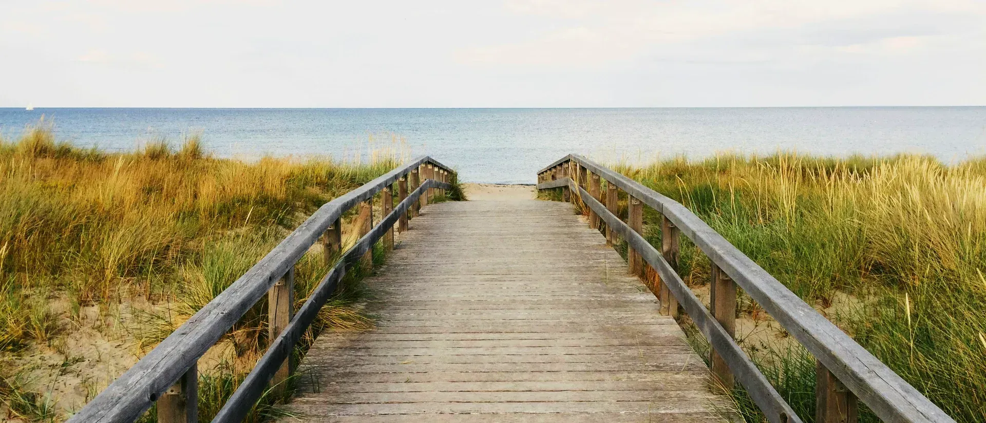 A boardwalk crossing the dunes toward the ocean